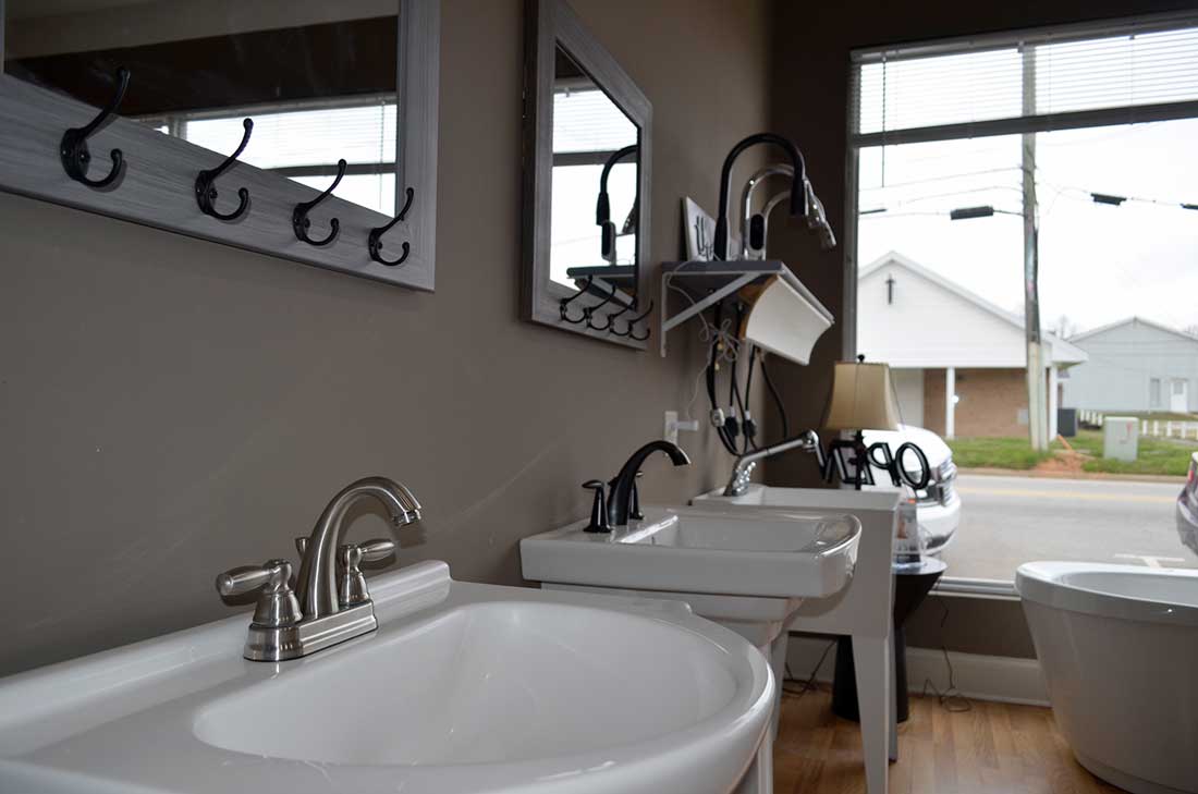 Vanity sink with a brushed nickel faucet, one of the fixtures set during shower, tub and sink installation in Wake Forest, NC