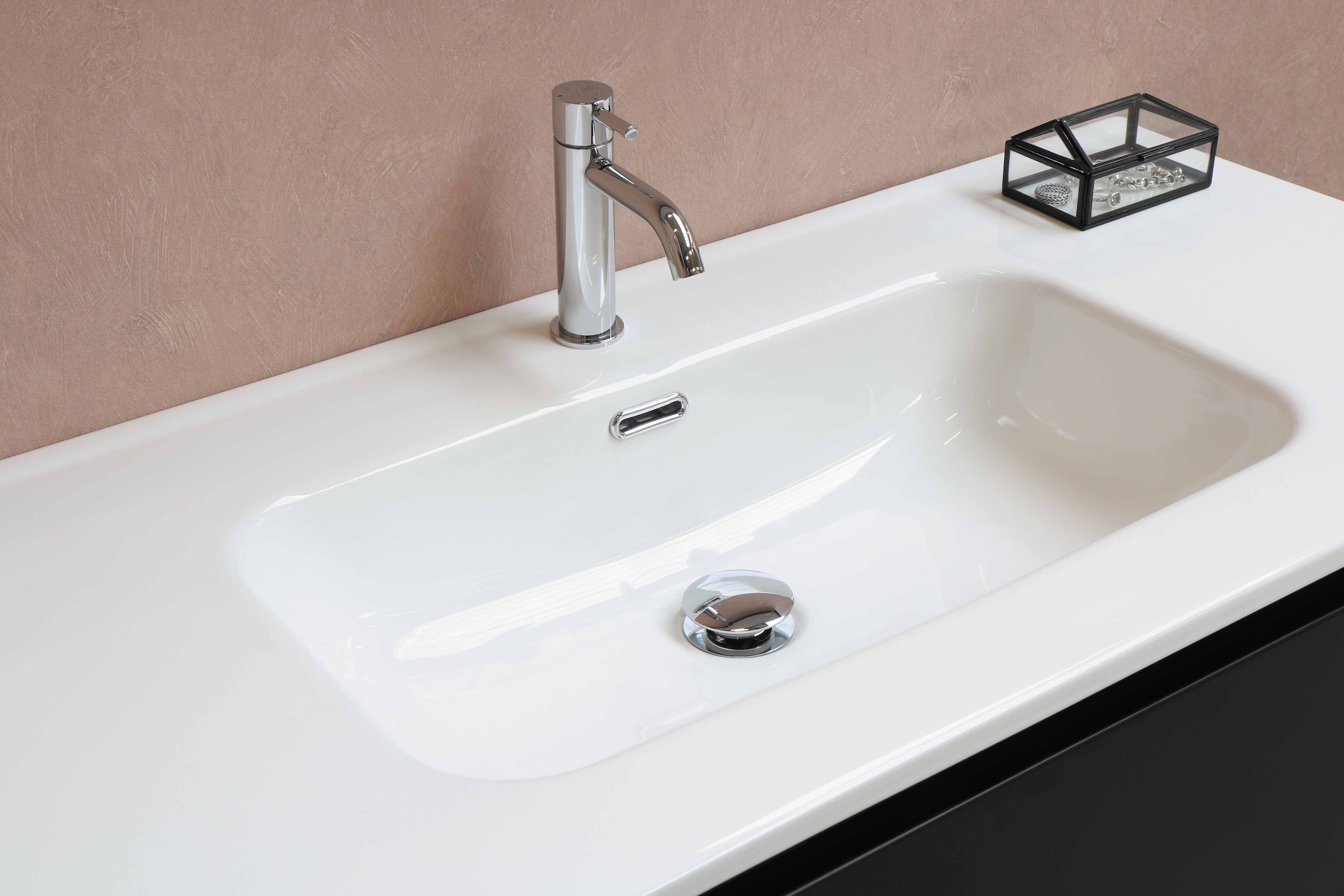 Clean white bathroom basin with a chrome mixer tap, the kind of single-fixture problem that can wait for a scheduled visit rather than an emergency plumber in Wake Forest, NC