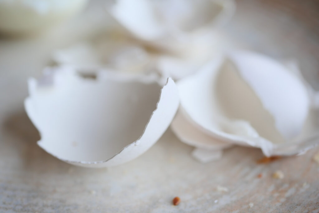 eggshells in a white color bowl on table