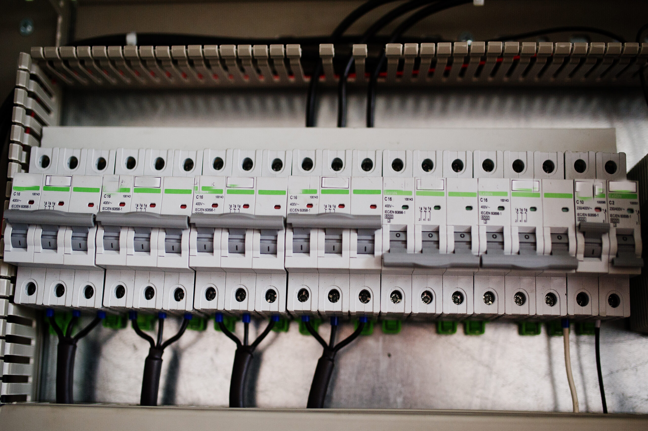 Electrical panel inspected before installing whole-house surge protection